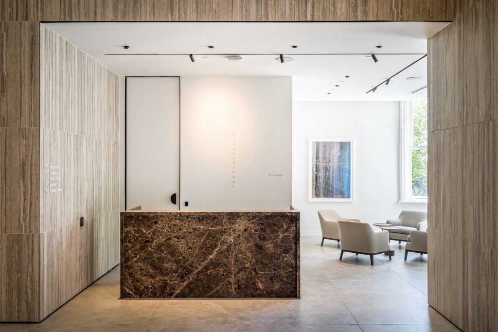 Concierge desk in stone and timber